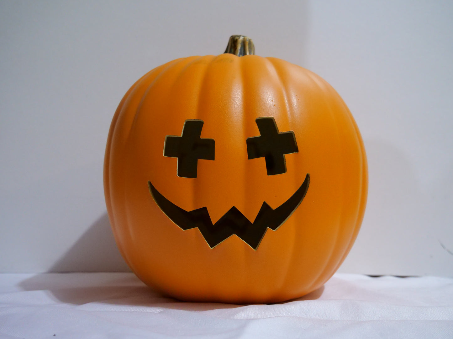 Cross eyes and croaked smile